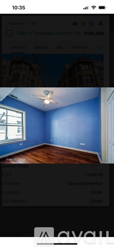 A room with blue walls and wooden flooring is shown.