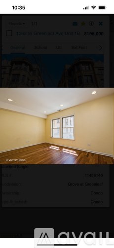 A room with wooden flooring and a window.