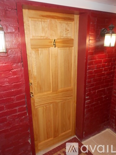 A wooden door with the number 4 on it.