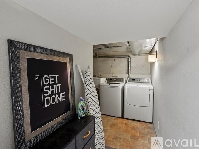 A laundry room with a washer and dryer.