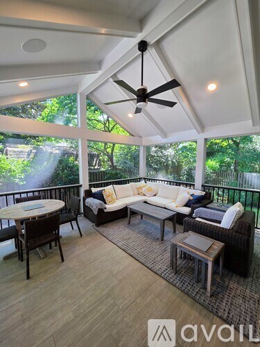 A patio with furniture and a ceiling fan.