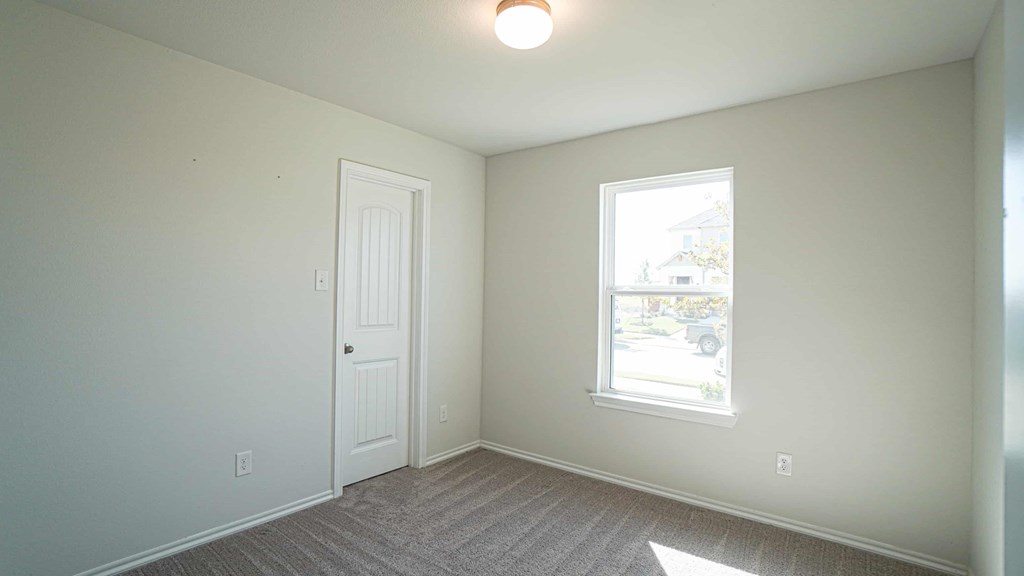 A room with a door and a window.