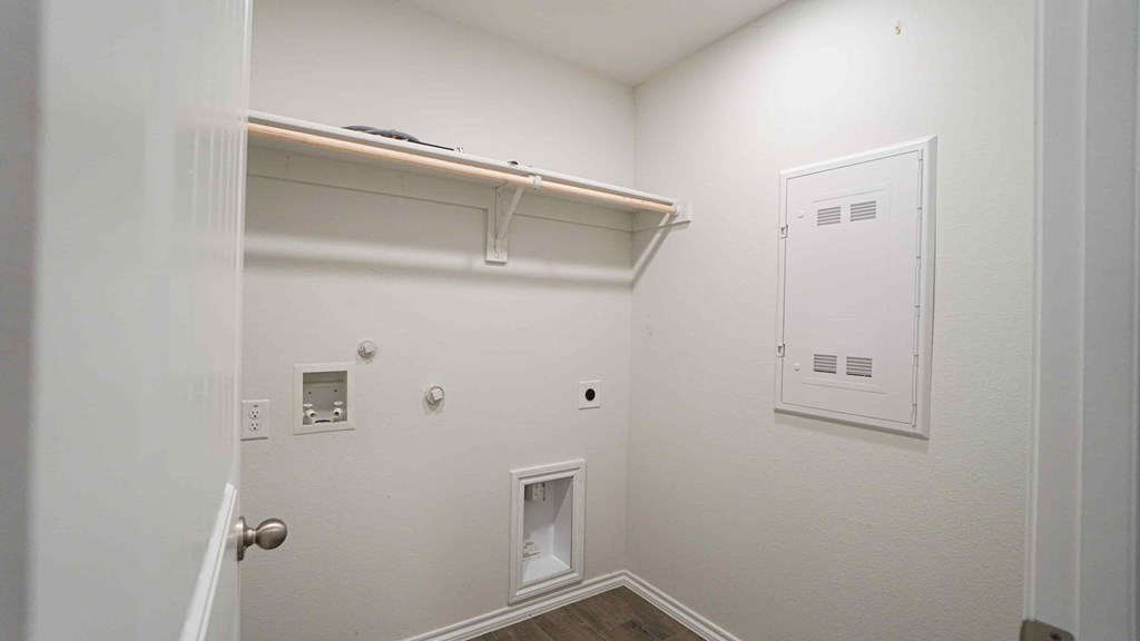 A white door with a silver handle is on the left side of the image.