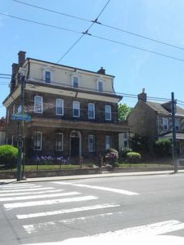 A building with a blue sign on the front.