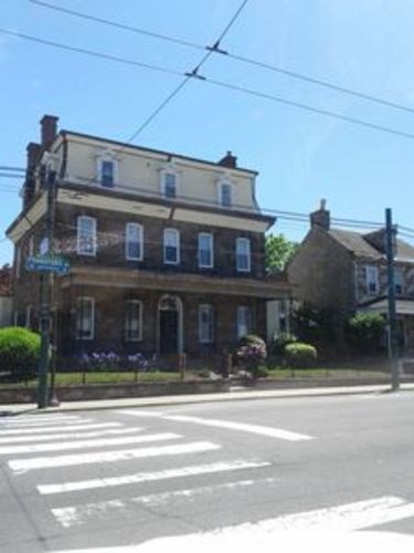 A building with a blue sign on the front.