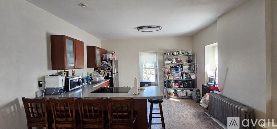 A close up of a chrome bathroom faucet with a shower head attached.
