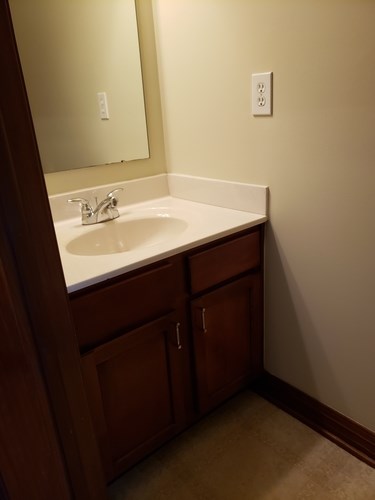 A bathroom sink with a mirror above it.