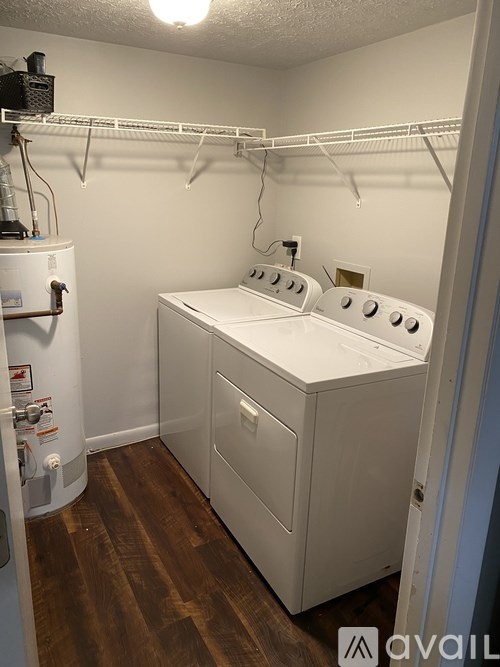 A laundry room with a washer and dryer.
