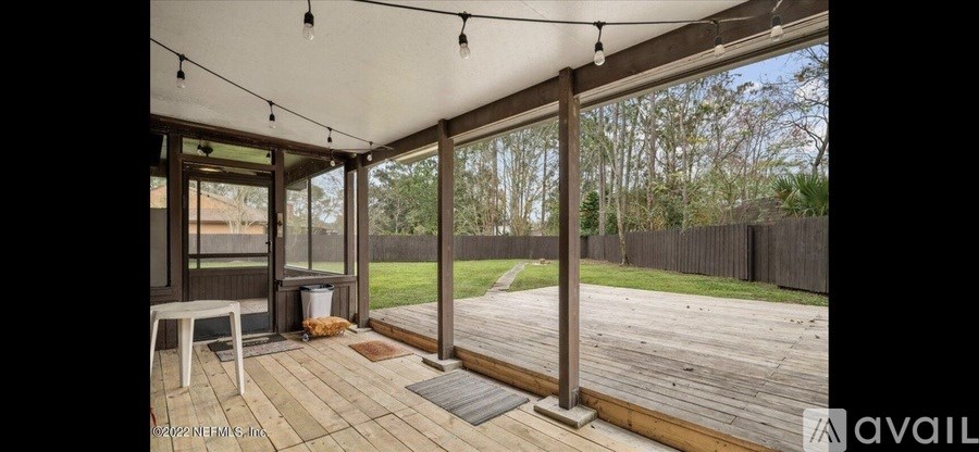 A patio with a table and chairs is available for rent.