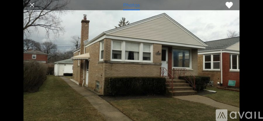 A house with a white door and a brown roof.