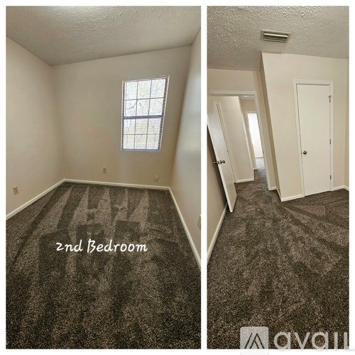 A bedroom with a carpeted floor and a window.