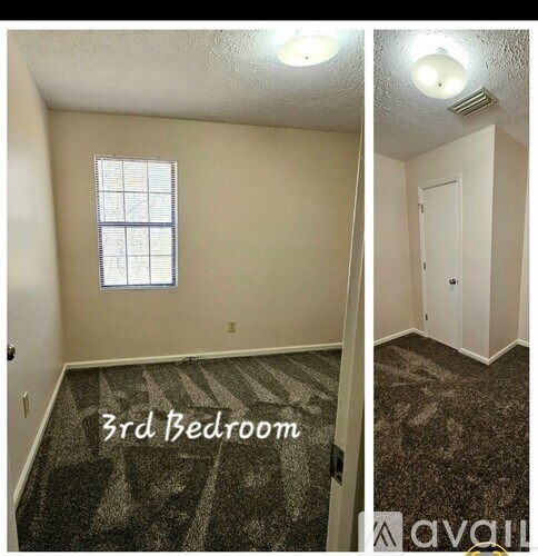 A bedroom with a window and a door.