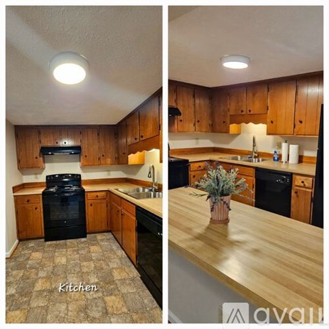 A kitchen with wooden cabinets and a black oven.