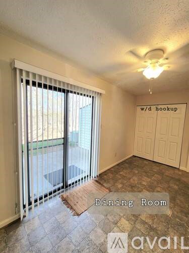 A dining room with a sign that says "w/d hookup" on the wall.