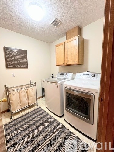 A laundry room with a washer and dryer.