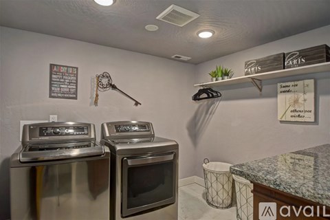 A kitchen with two ovens and a microwave.