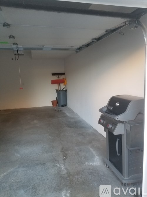 A room with a floor that is half painted and half unpainted.