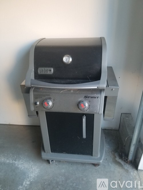 A charcoal grill with the brand name "Spirit" on it.