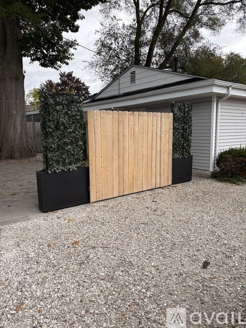 A sunset over a calm body of water with a wooden post sticking out of the water.