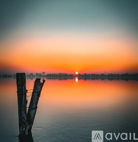 A bathroom with a toilet, sink, and a walk-in shower.