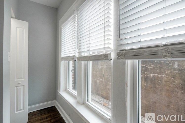 A room with a window and a door.