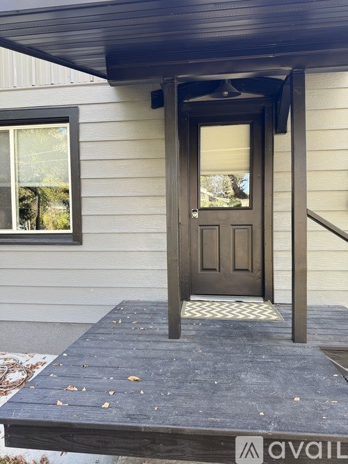 A house with a brown door and a window.