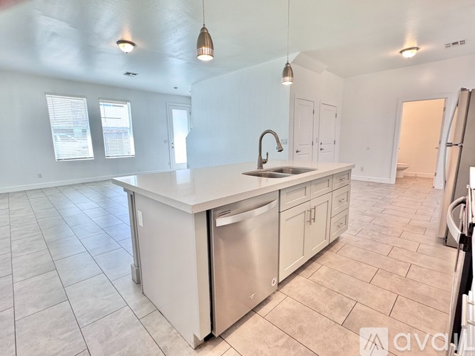 A white bathroom with a toilet, sink, and bathtub.