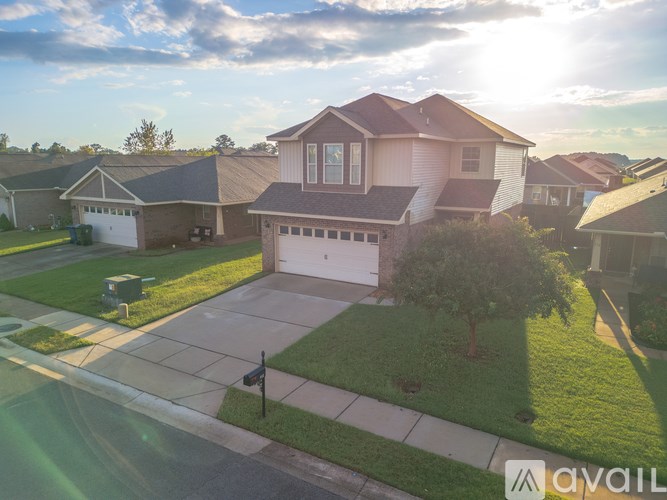 A house with a garage is located in a residential area.