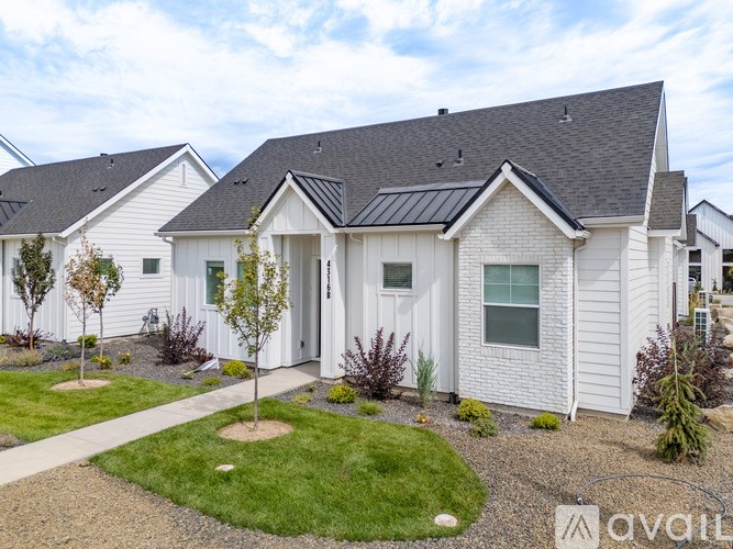 A room with wooden flooring and a window with blinds.