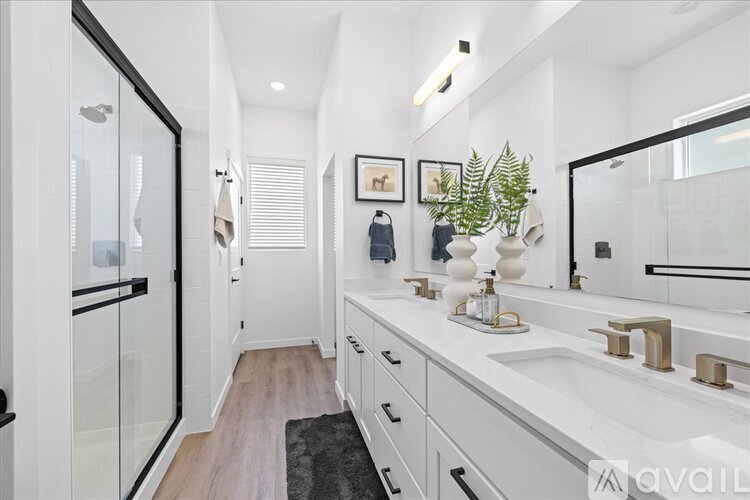 A kitchen with white cabinets and appliances.