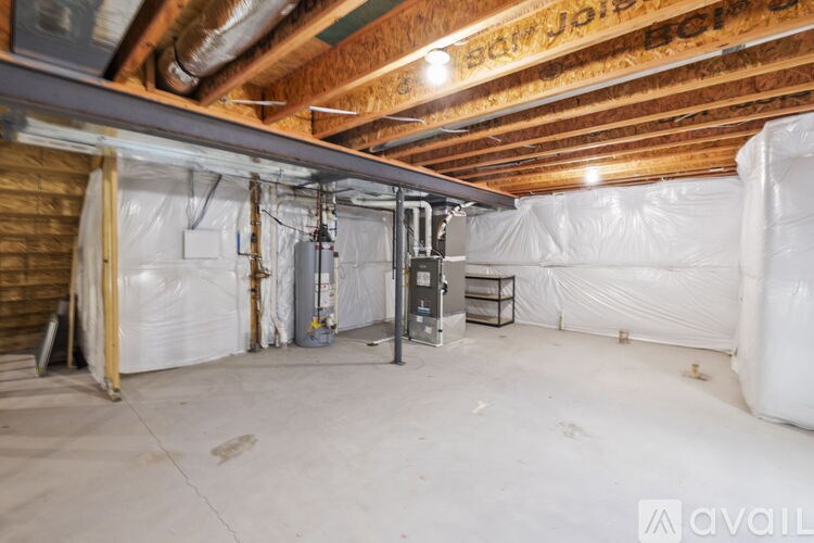 A room with a wooden ceiling and insulation on the walls.
