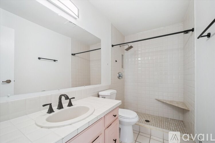 A room with a water heater and pipes.