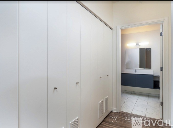 A white dishwasher and oven in a kitchen.