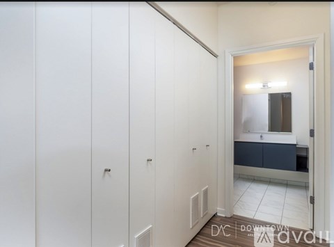 A white dishwasher and oven in a kitchen.