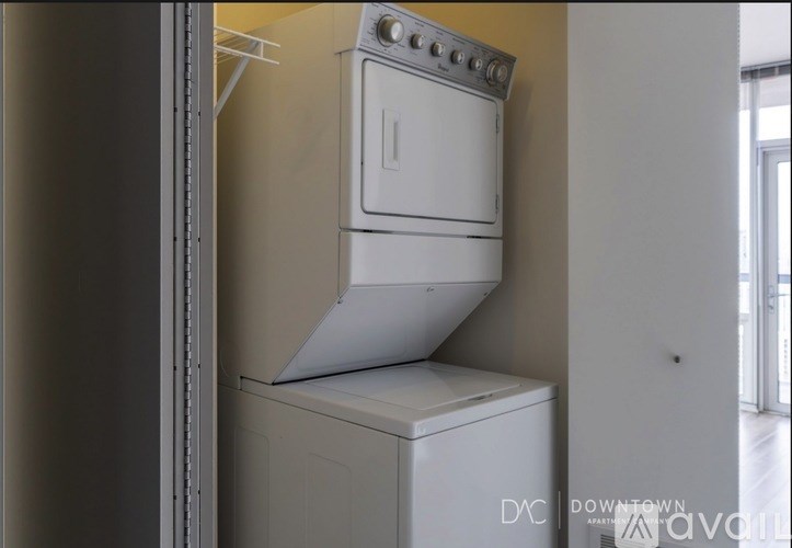 A white oven and stove top are in a kitchen.