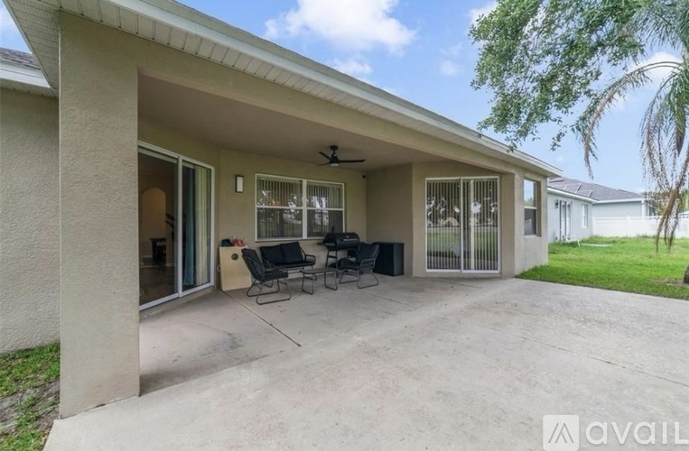 A patio area with a table and chairs is available for rent.