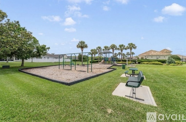 A playground with a swing set and a slide.