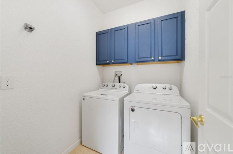 A laundry room with a washer and dryer.