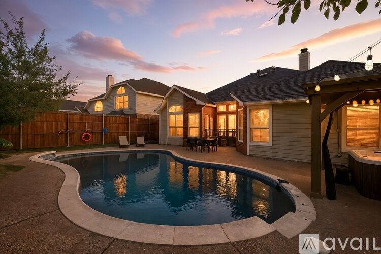 A house with a pool in the backyard.