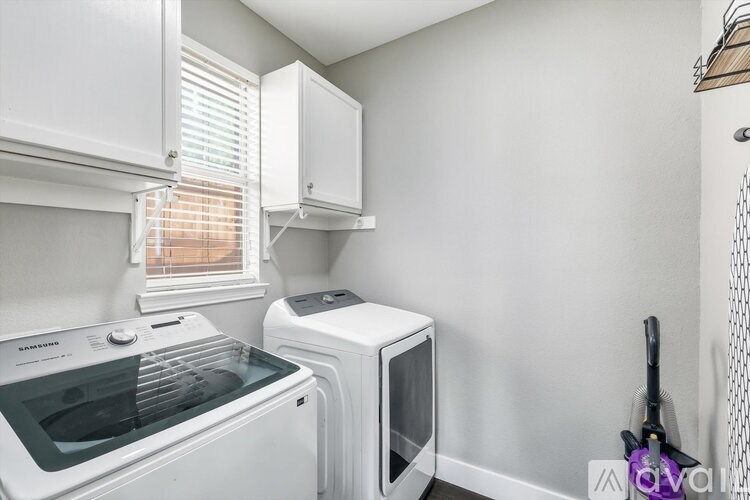 A white oven and microwave in a small kitchen.