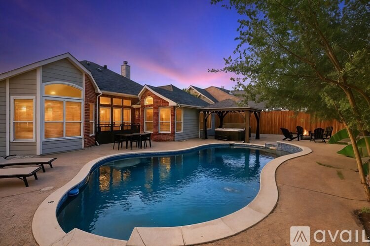 A house with a pool in the backyard.