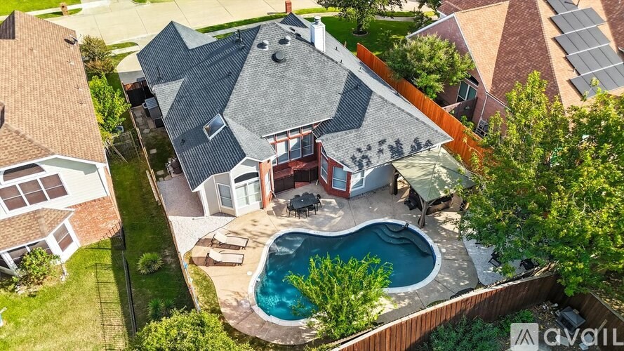 A house with a pool in the backyard.