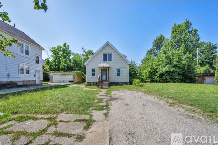 A house with a driveway in front of it.