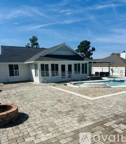 A house with a pool in the backyard.