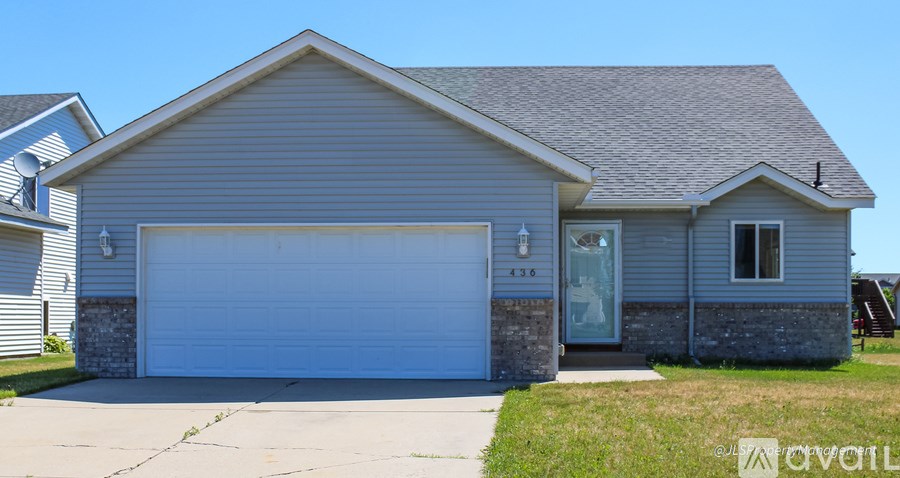 A two-car garage is attached to a house.