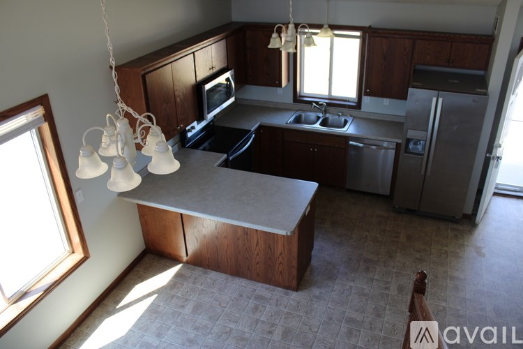 A kitchen with a large island in the middle.