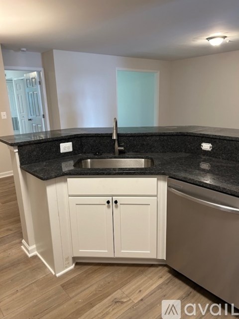 A kitchen with a sink and cabinets.