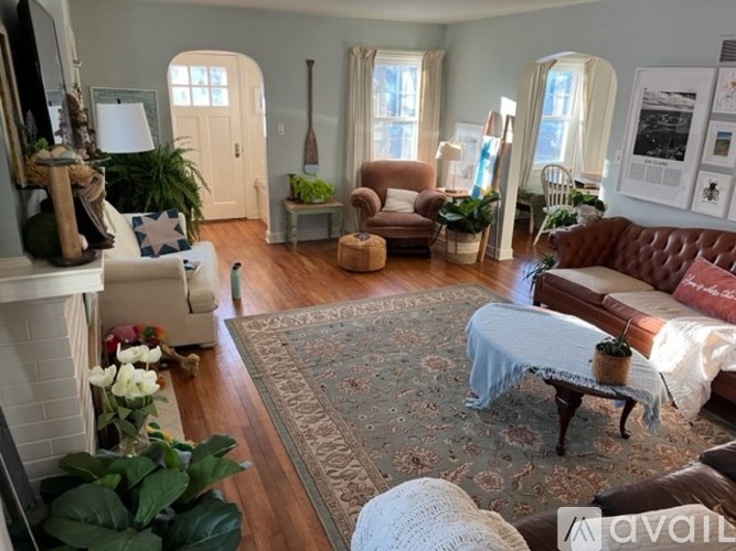 A living room with a fireplace and a couch.