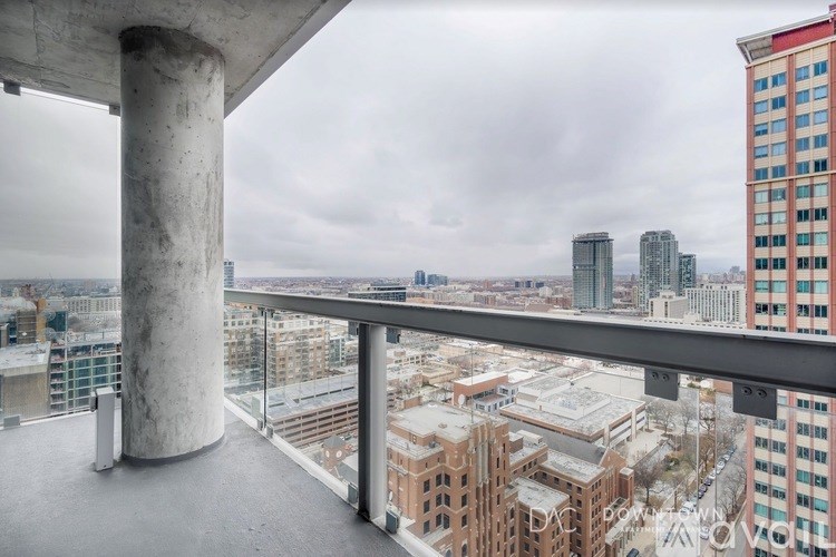 A view from a high-rise building looking out over a cityscape.
