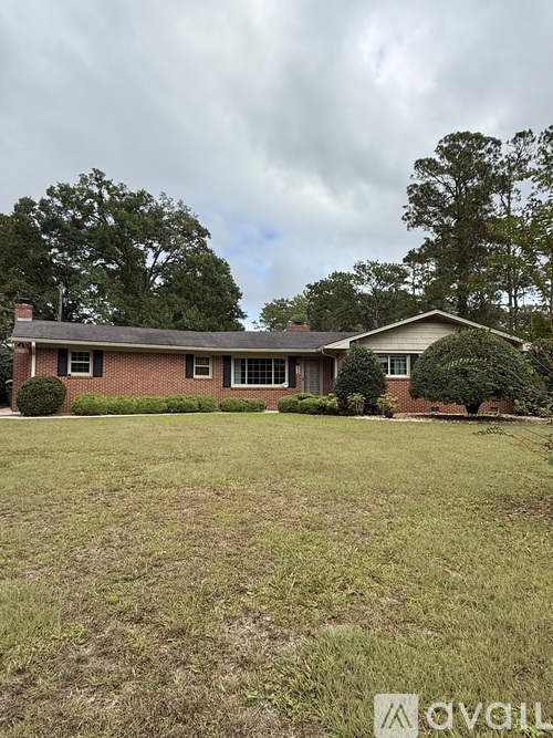 A house with a lawn in front of it.